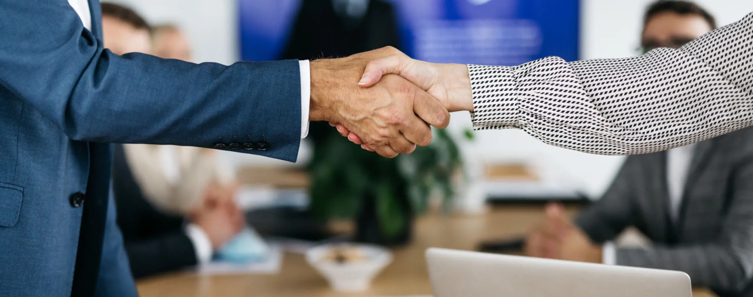 Business handshake in office meeting