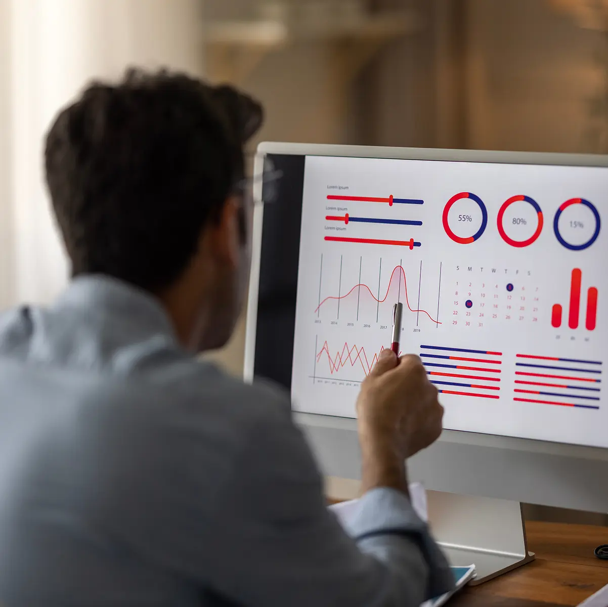 Business professional reviewing charts and graphs